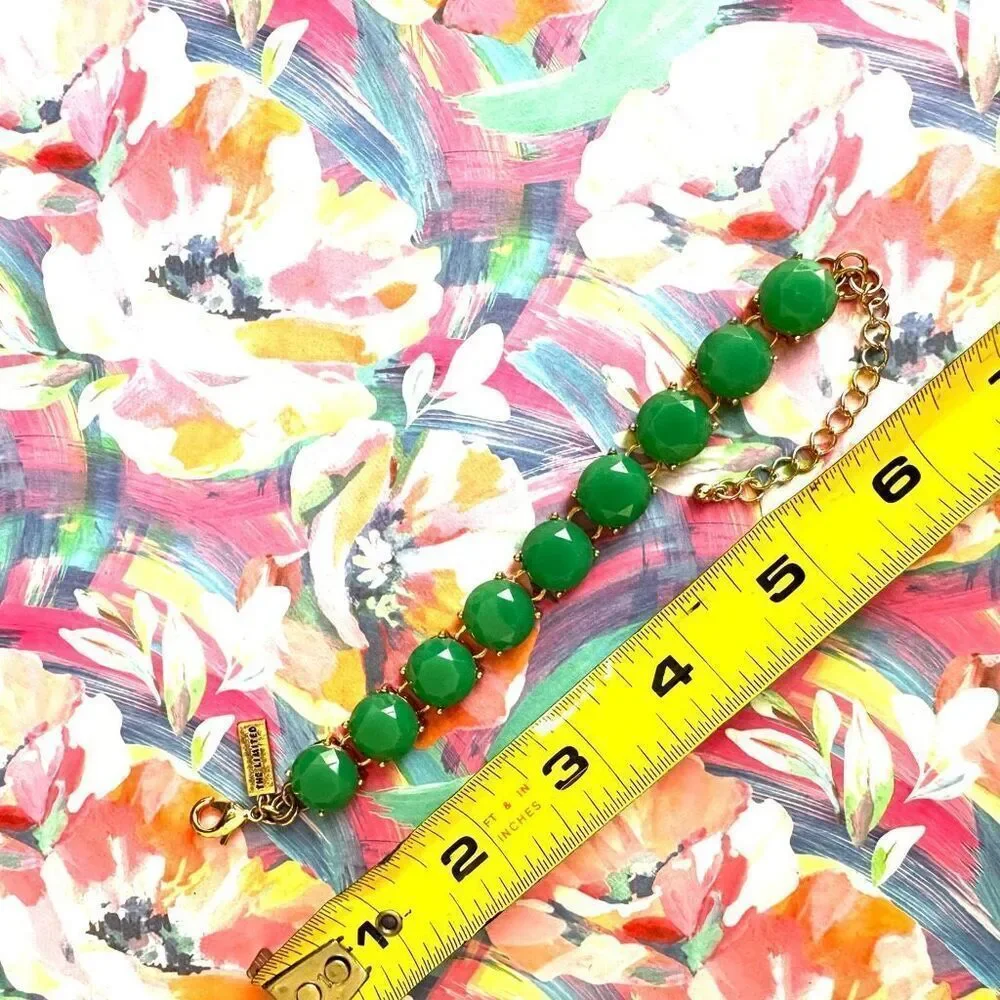 The Limited gold tone and green bracelet